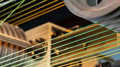 Cable production. Close up of a cable reel, manufacturing zone